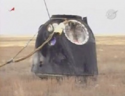 Figure 3.14. Our charred Descent Module rests upright on the steppes of Kazakhstan following a job well done. (Courtesy of NASA.)