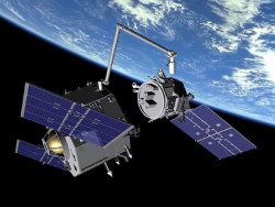 Figure 9.12. On-orbit spacecraft servicing: artist’s rendition of Orbital Express during unmated operations (Courtesy of Boeing).