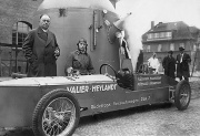 Industrialist Paul Heylandt (left) with Max Valier and Rak 7 rocket car, April 1930. Papa Riedel in the background in white coat.