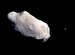 Figure 5.5. Image of the asteroid Ida, and its tiny moon Dactyl, as viewed from the Galileo spacecraft en route to Jupiter in 1991 (Courtesy of NASA).